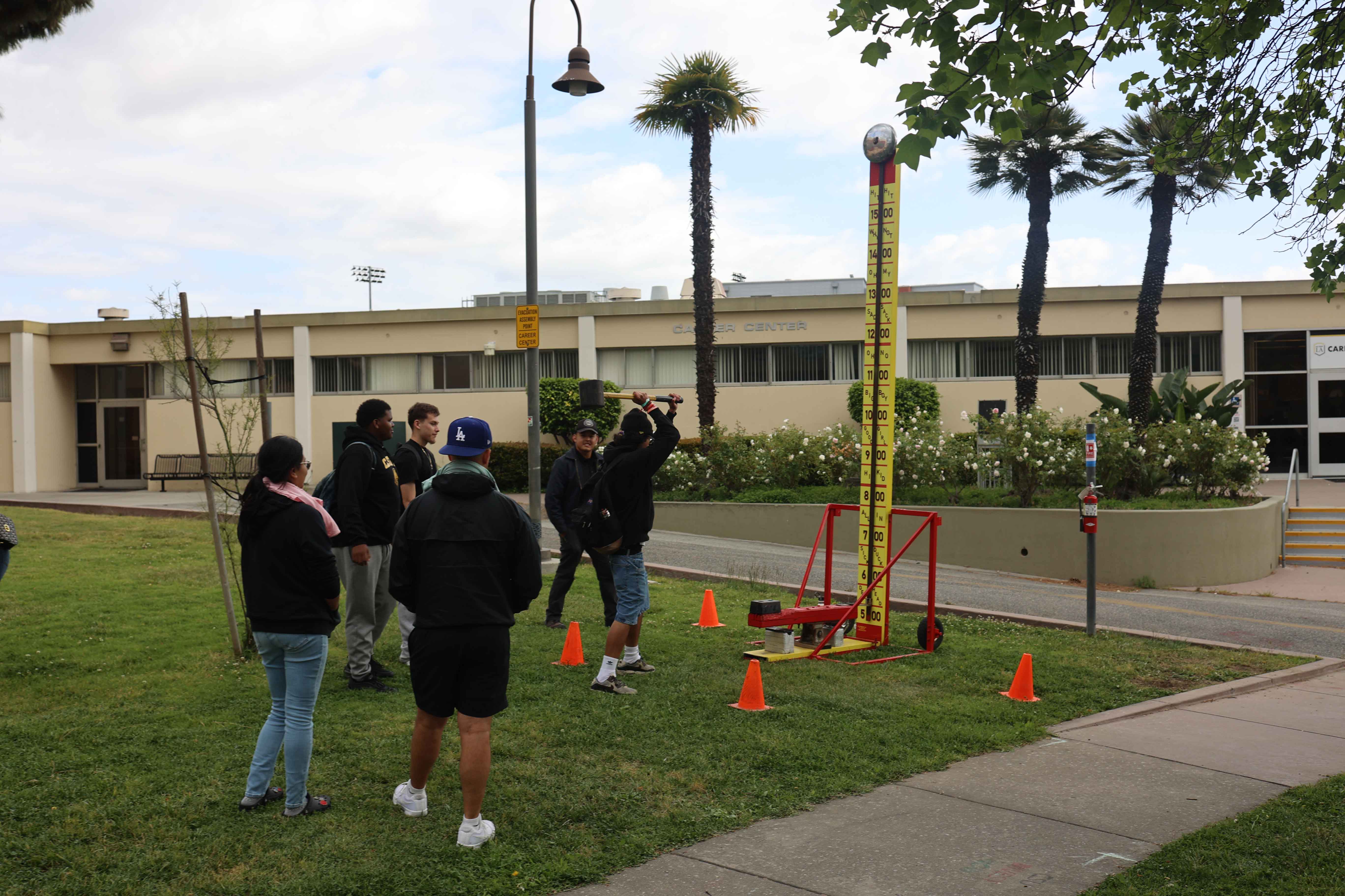 Students playing a strength challenge game at Eddie Fest